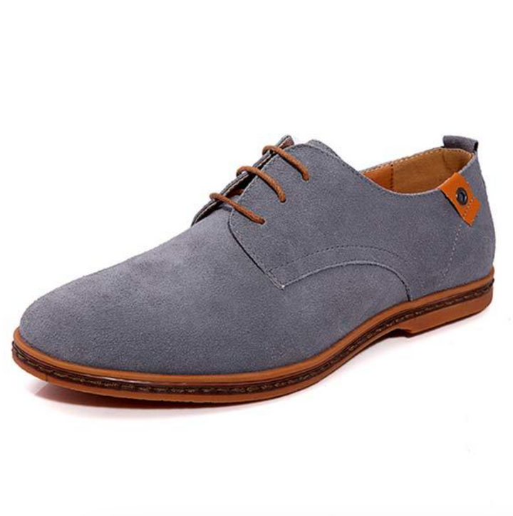 Detailed shot of men's sleek black Derby shoes with precise lace-up closure, showcasing quality craftsmanship.