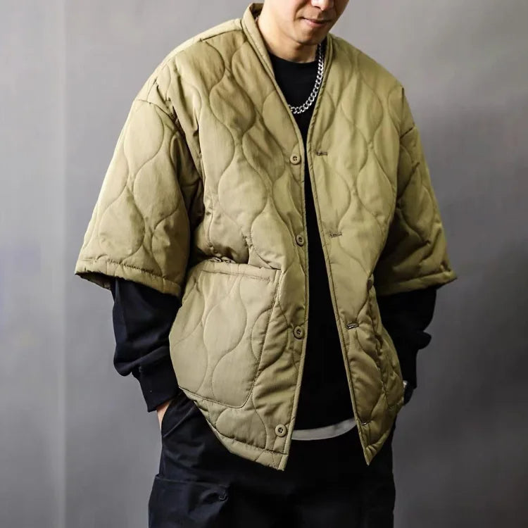 Man wearing a sleek quilted bomber jacket, an essential piece of stylish men's casual outerwear for fall and winter.