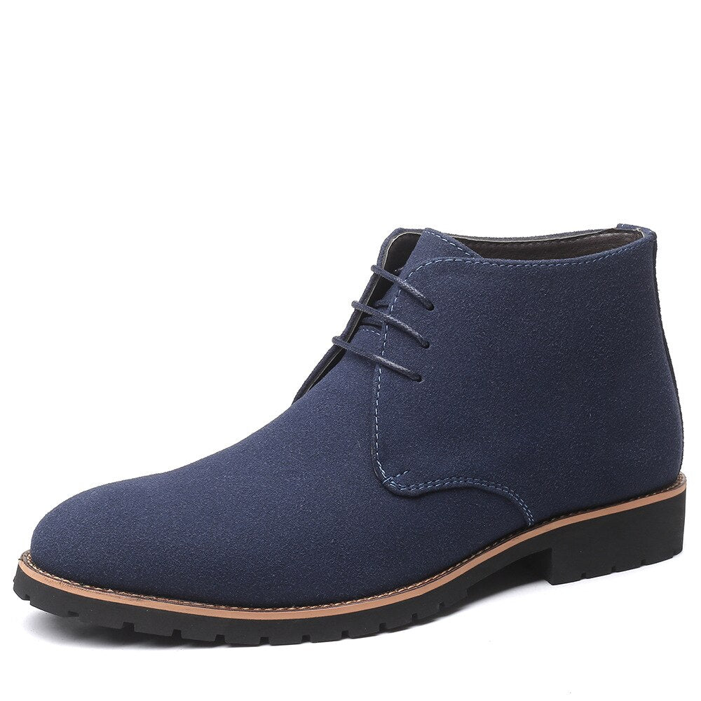 Stylish men's brown slip-on ankle boots, ideal for casual outfits and everyday comfortable wear.