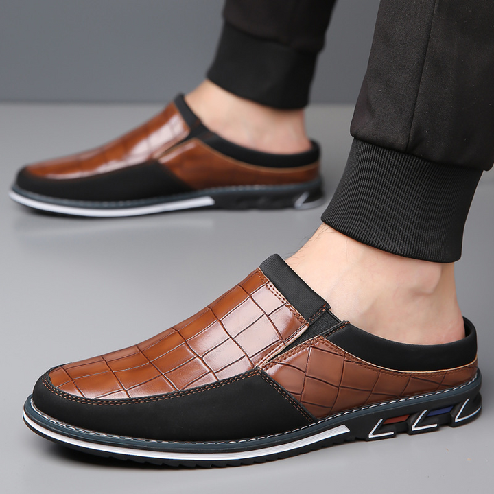 Smart men's slip-on mules, combining sleek design with all-day comfort features.