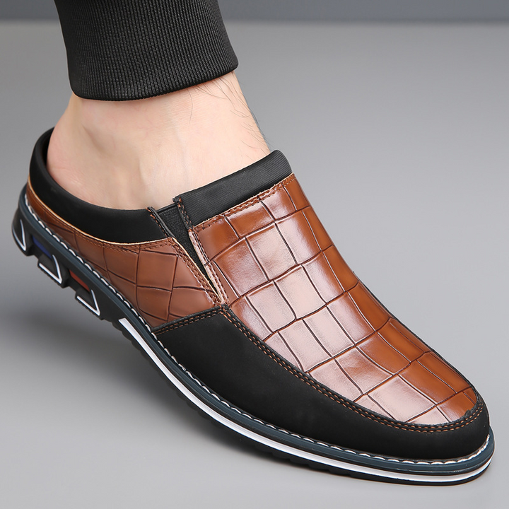 Contemporary men's mules, slip-on style for ultimate convenience and fashion-forward appeal.