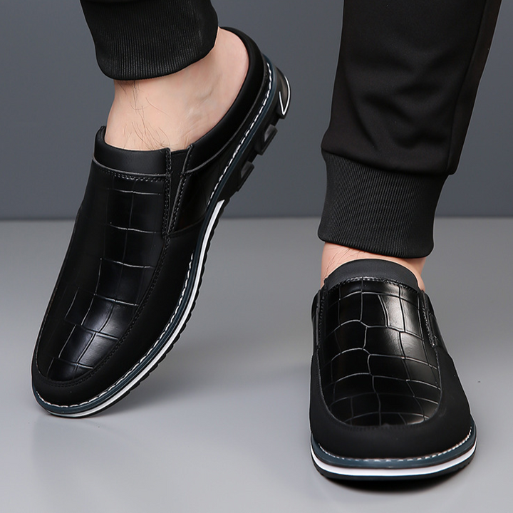 Modern men's mules with a sleek design, offering ultimate slip-on convenience.