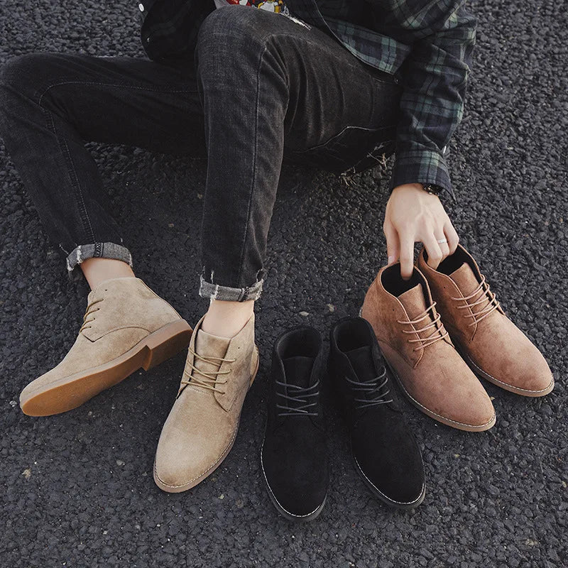 Khaki men's Chelsea boots featuring elastic side panels, providing rugged style and all-day comfort.