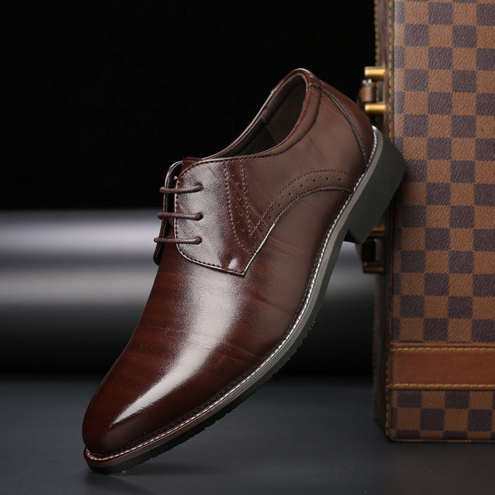 Classic black leather brogue lace-up shoes with intricate detailing, ideal for weddings and formal events.