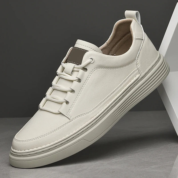 Beige men's lace-up comfort sneakers with traction outsole, ideal for versatile wear.