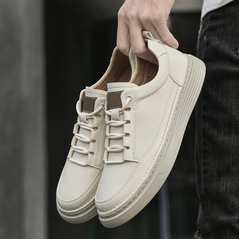 Brown men's sneakers featuring a comfortable fit and trendy low-top aesthetic.