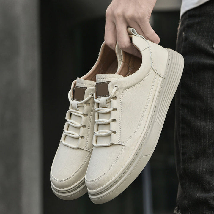 Brown men's sneakers featuring a comfortable fit and trendy low-top aesthetic.