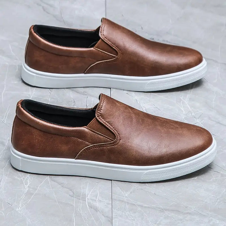 Men's stylish brown slip-on loafers. Versatile, comfortable footwear for casual or formal everyday wear.