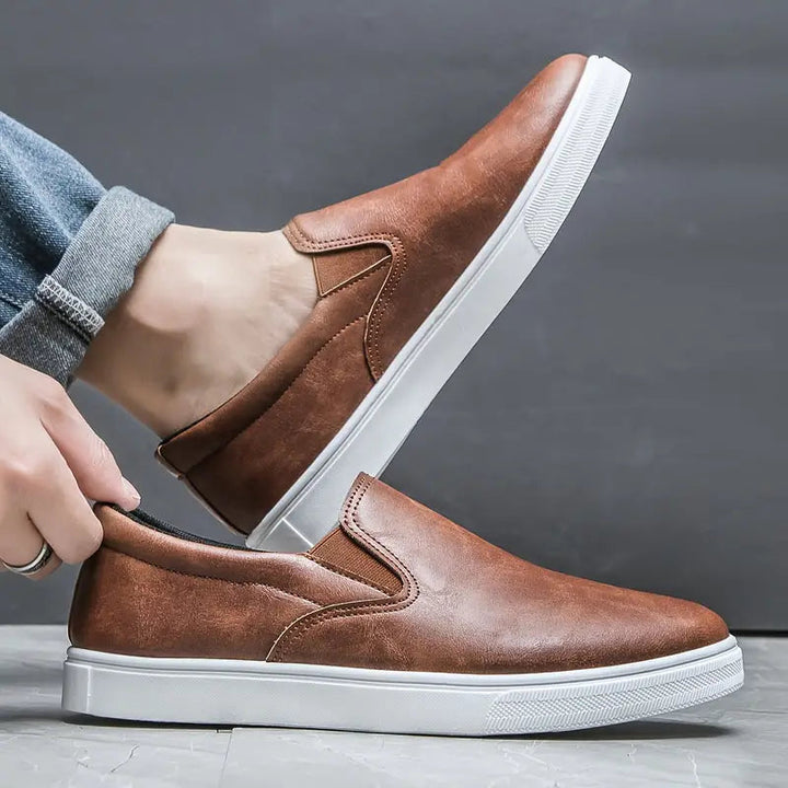 Sleek black men's slip-on loafers, comfortable and versatile. Perfect casual or formal everyday footwear.