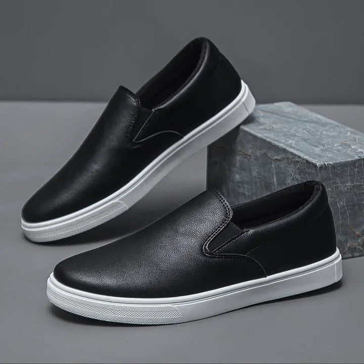 Versatile men's slip-on loafers in black, suitable for both casual and formal everyday wear. Stylish and comfortable.