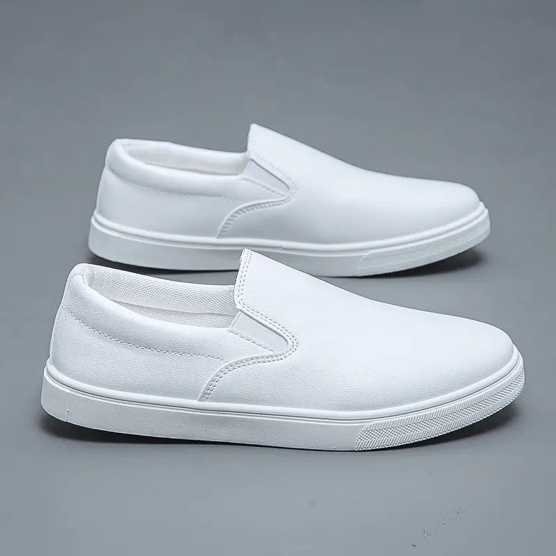 Pair of men's brown slip-on loafers for stylish everyday wear. Comfortable, sleek casual-to-formal footwear.