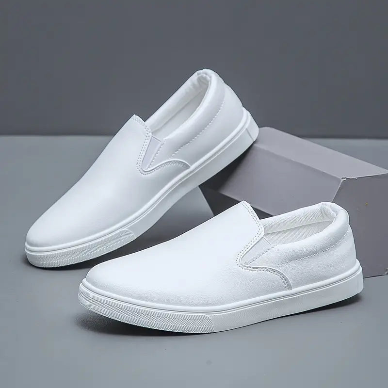 Top-down view of men's black slip-on loafers. Comfortable, sleek, and versatile everyday footwear for men.
