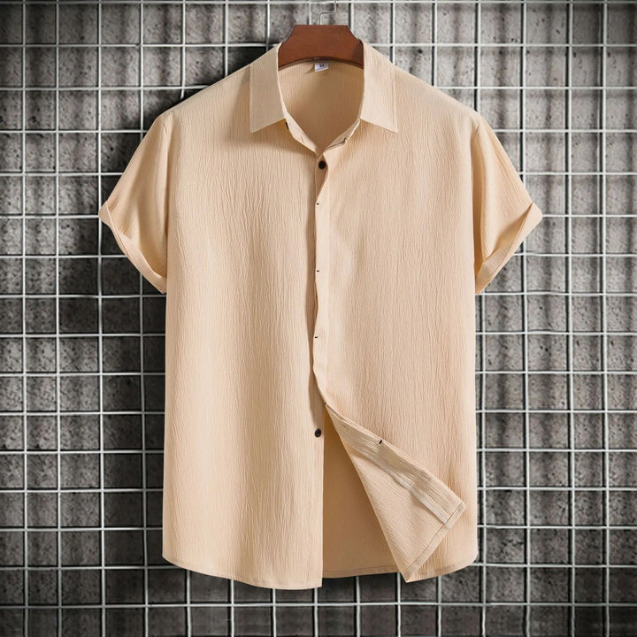 Men's stylish button-down shirt, long sleeve, versatile for casual & formal occasions.