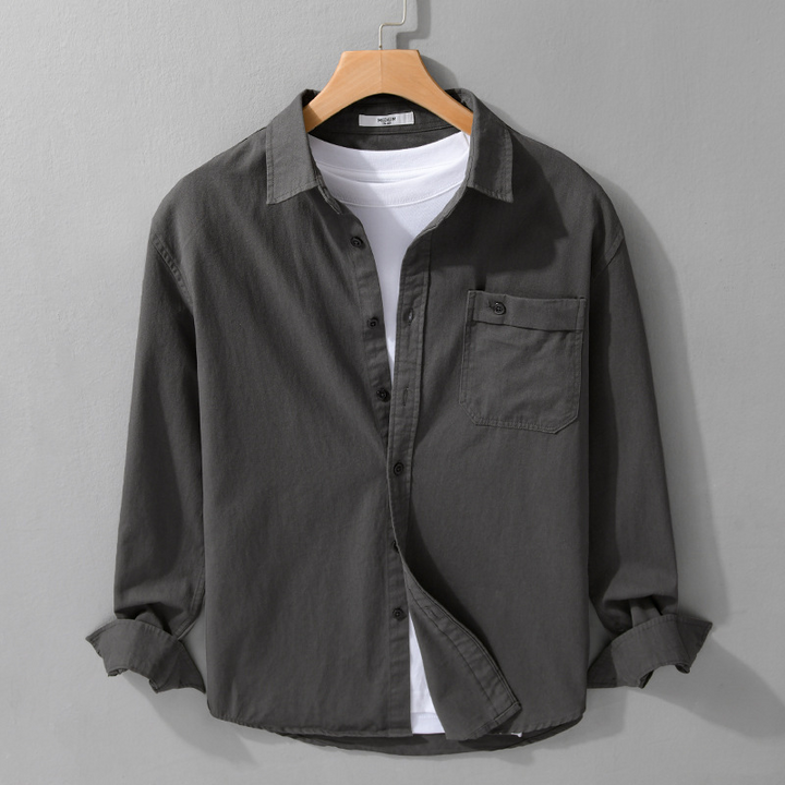 Breathable men's long sleeve button-down shirt. Lightweight and comfortable for casual summer or office wear.