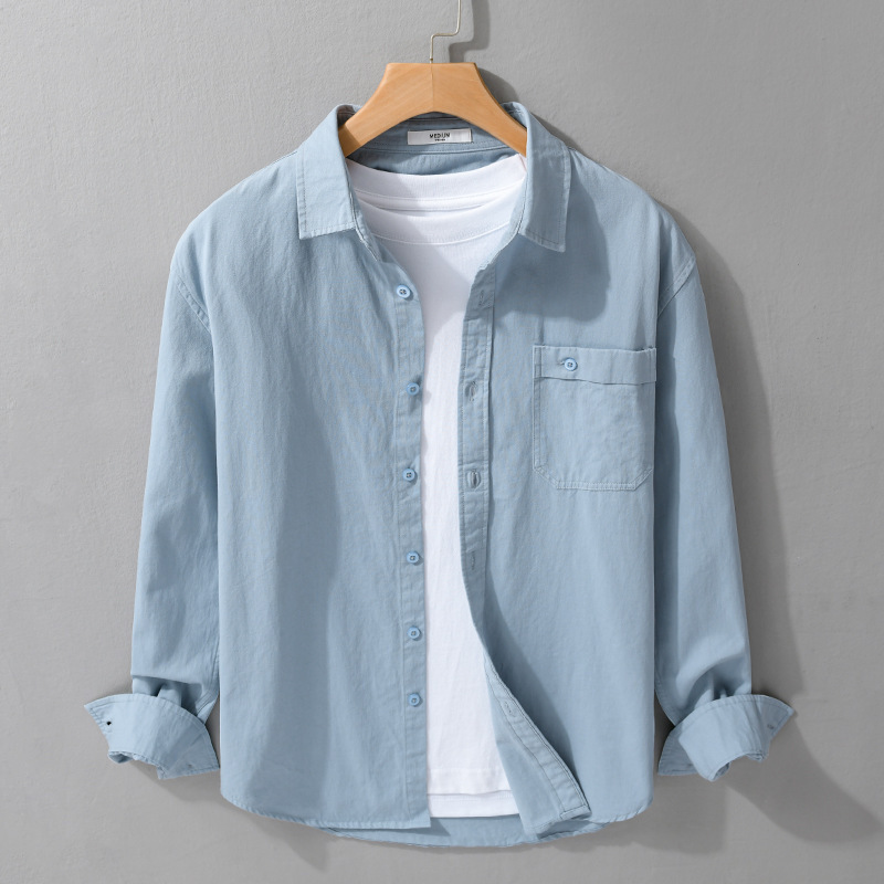 Comfortable men's button-down shirt. Lightweight, breathable long sleeve for stylish summer or office attire.