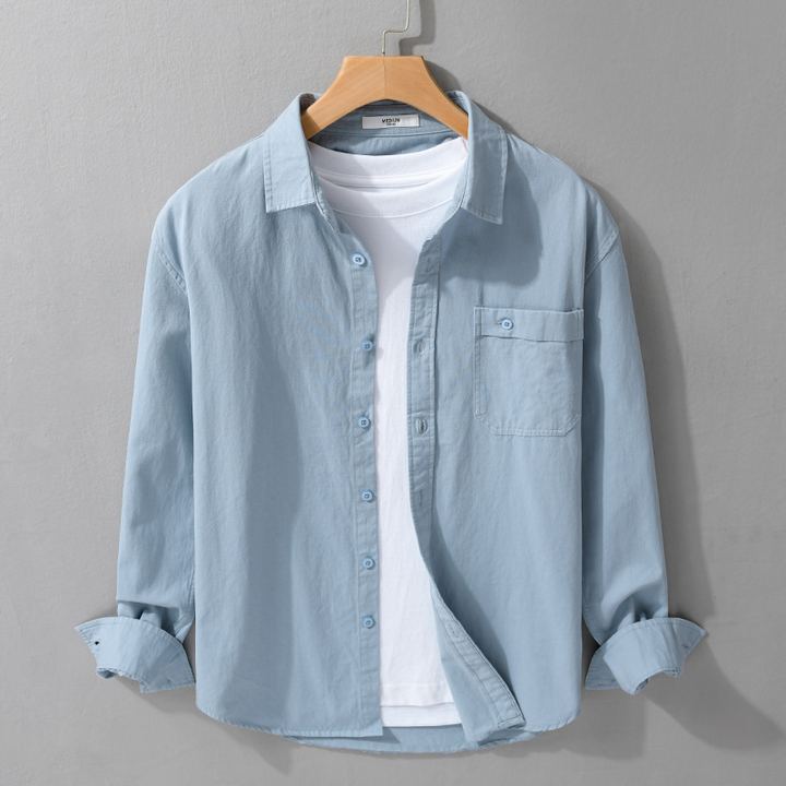 Comfortable men's button-down shirt. Lightweight, breathable long sleeve for stylish summer or office attire.