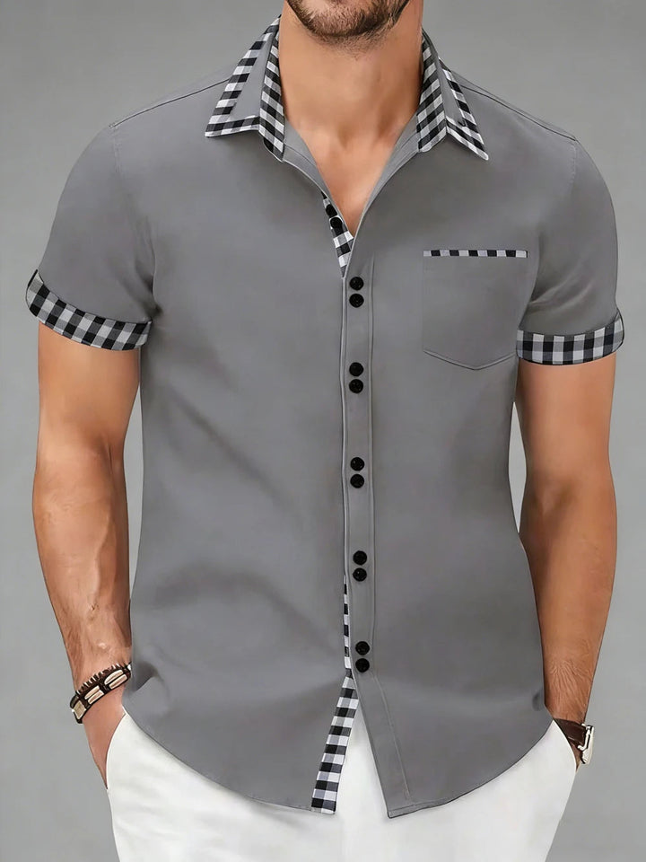 Modern collared men's checkered shirt, wrinkle-resistant. Stylish button-up for business casual fashion.