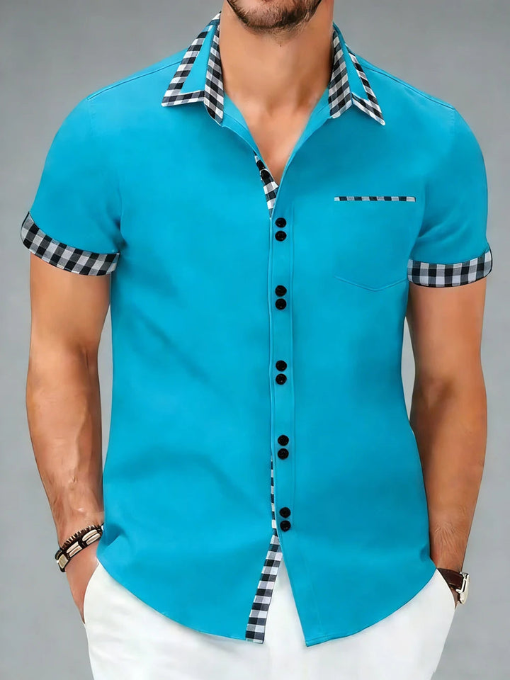 Close-up of the elegant checkered pattern on a men's stylish button-up long sleeve shirt.