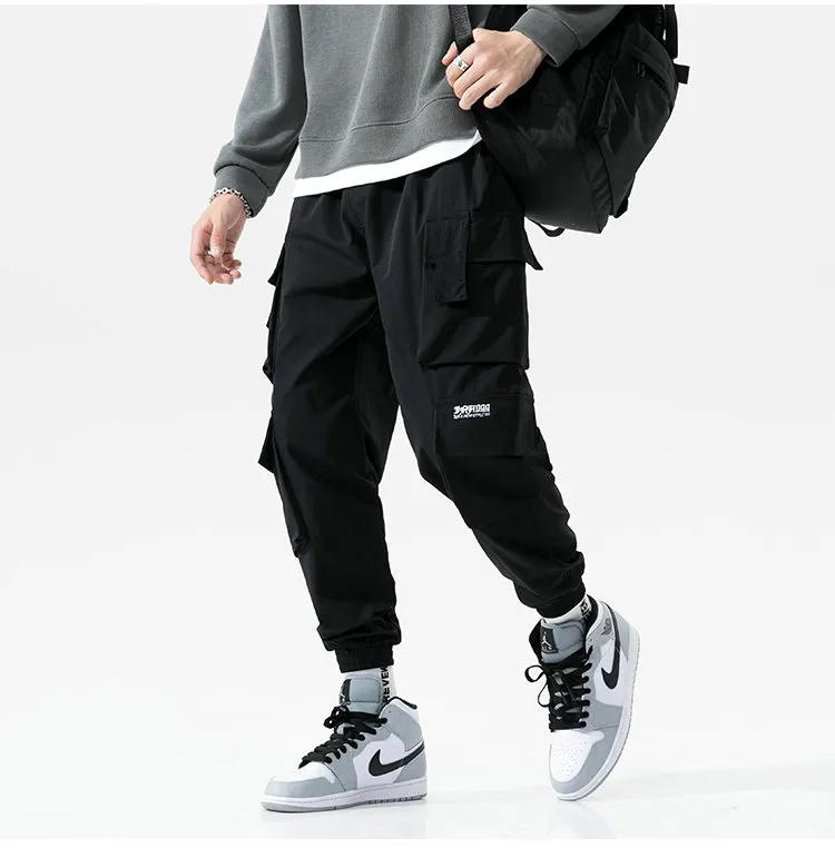 Modern men's streetwear cargo joggers, blending style with urban comfort and practical utility pockets.