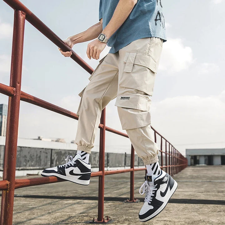 Men's stylish cargo joggers, an athletic bottom with utility pockets designed for ultimate urban comfort.