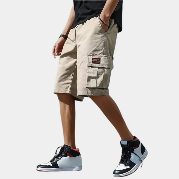 Relaxed fit men's cargo shorts with multiple pockets, ideal for travel and utility in a trendy style.
