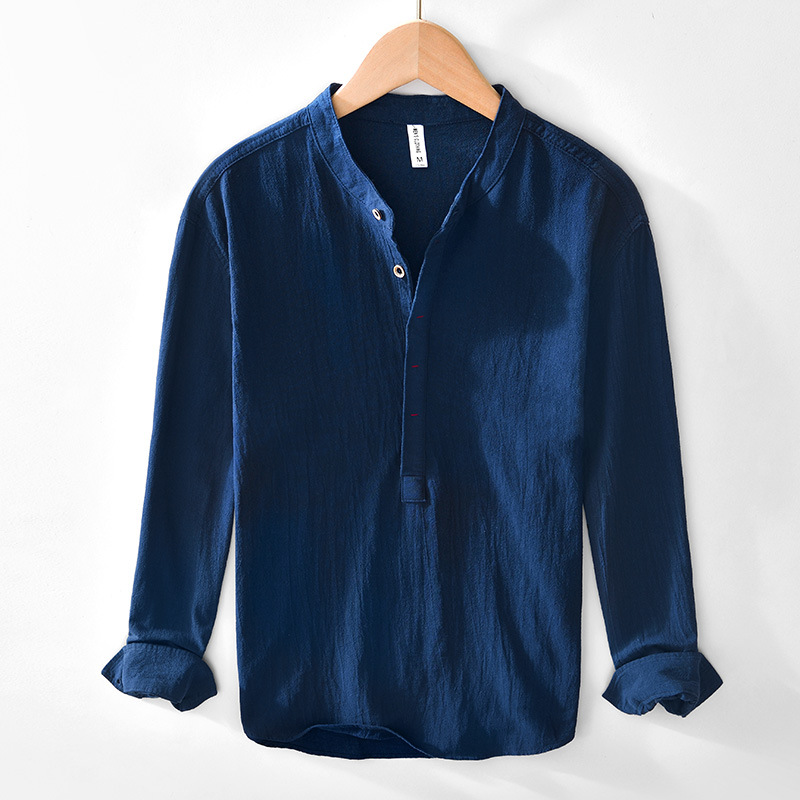 Stylish man wearing a breathable collarless long sleeve casual shirt for warm summer days.