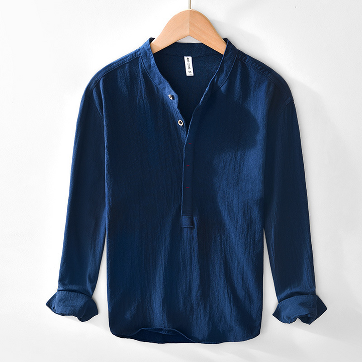 Stylish man wearing a breathable collarless long sleeve casual shirt for warm summer days.