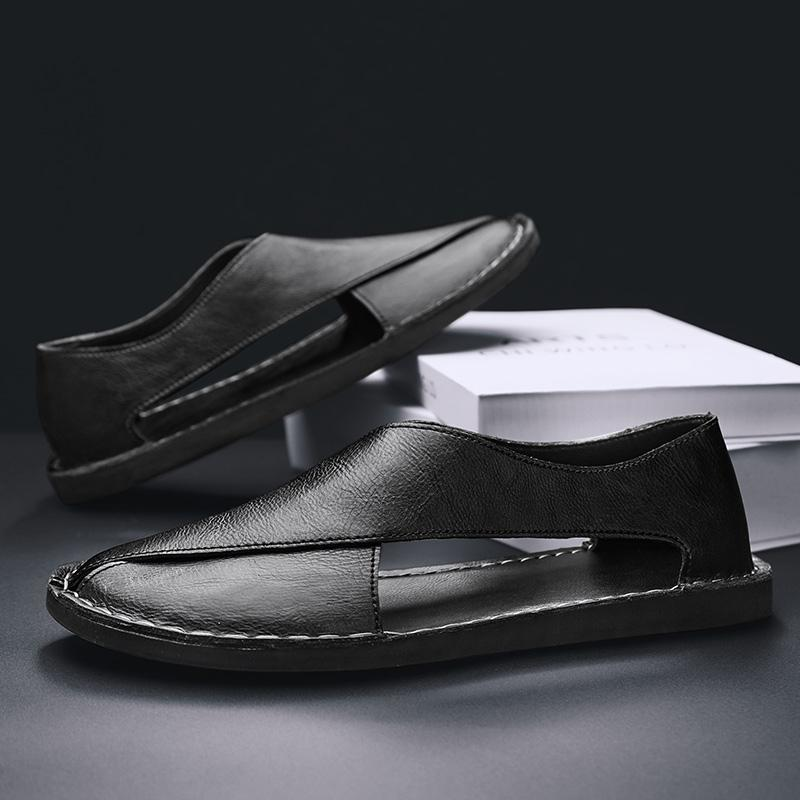 Fashionable men's cross-strap sandals, elevating casual summer and beach outfits.