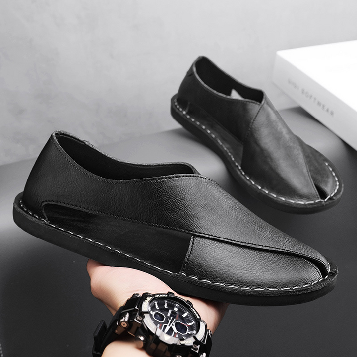 A pair of men's stylish cross-strap comfort sandals, ready for summer adventures.