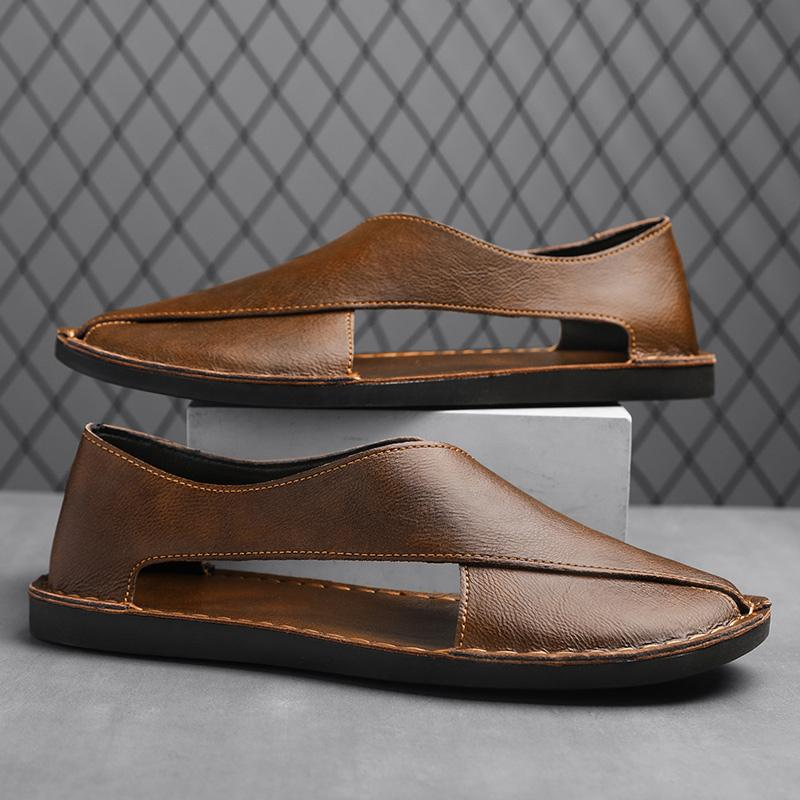 Comfortable footbed of men's open-toe cross-strap sandals, perfect for summer.