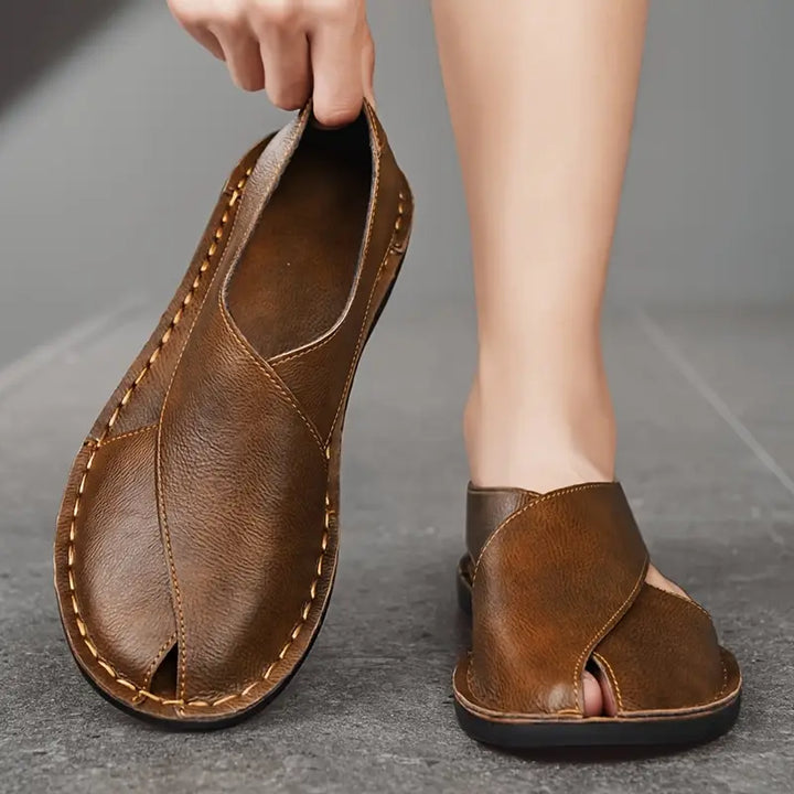 Back view of men's open-toe cross-strap sandals, showcasing a sturdy comfort sole.