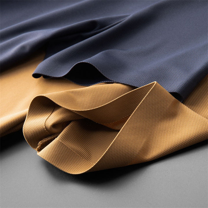 Men's dinner outfit: stylish polo shirt & tailored pants set. Elegant, comfortable two-piece for sophisticated evening wear.