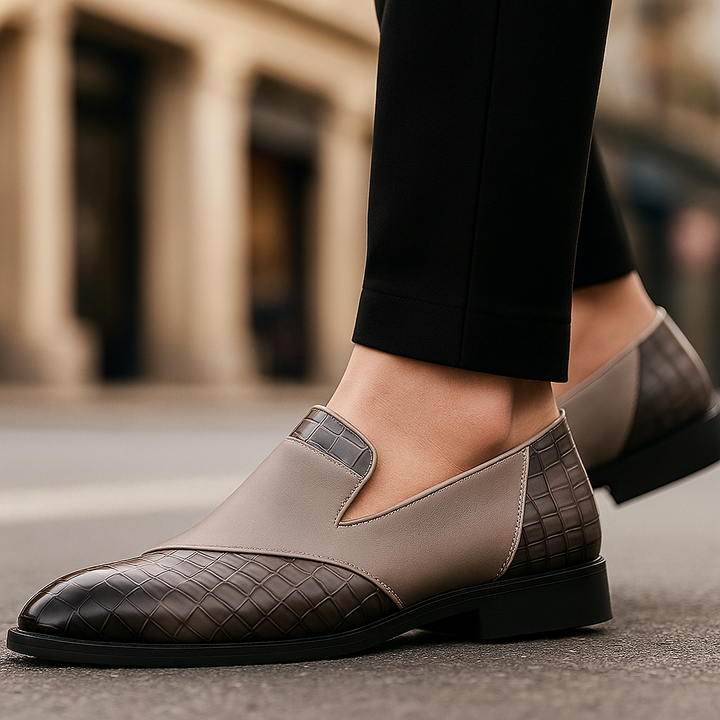 Men's formal footwear: Stylish croc-pattern loafers, sleek slip-on design for dressy business casual attire.
