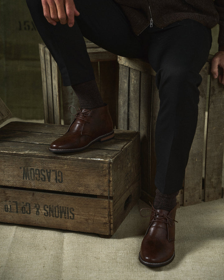 Stylish men's casual leather boots in dark brown, offering everyday comfort and rugged appeal.