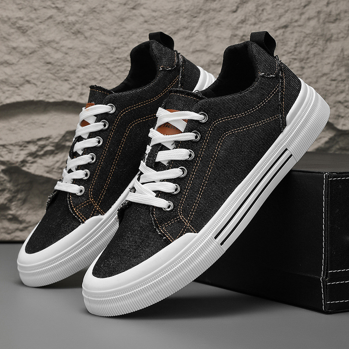 Back view of men's durable denim sneakers, trendy street style & foot comfort.
