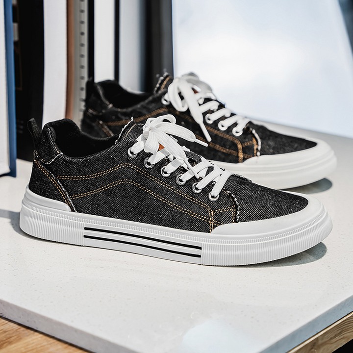 Durable sole of men's denim sneakers, designed for comfortable everyday street style.