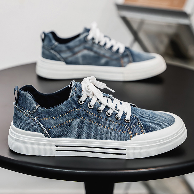 Man wearing stylish denim sneakers, walking casually for everyday foot comfort.