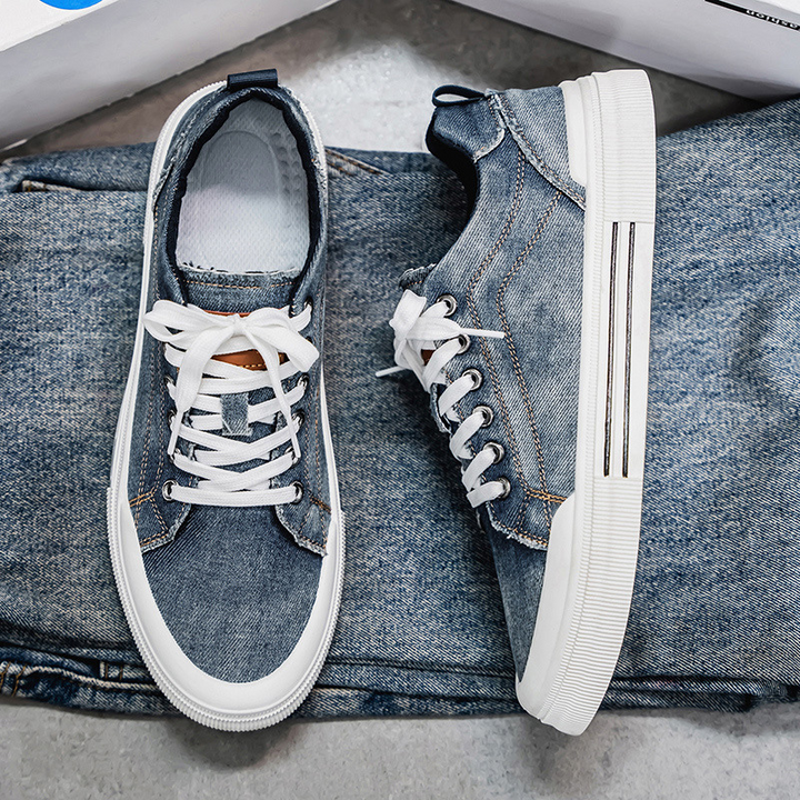 Close-up of trendy men's denim sneakers, showcasing durable casual footwear.