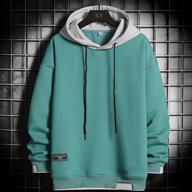 Men's stylish dual-tone hoodie with a modern layered hem. Perfect casual pullover for everyday comfort and streetwear.