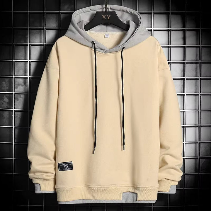 Comfortable men's dual-tone pullover hoodie. Features a unique layered hem for a stylish, modern casual look.