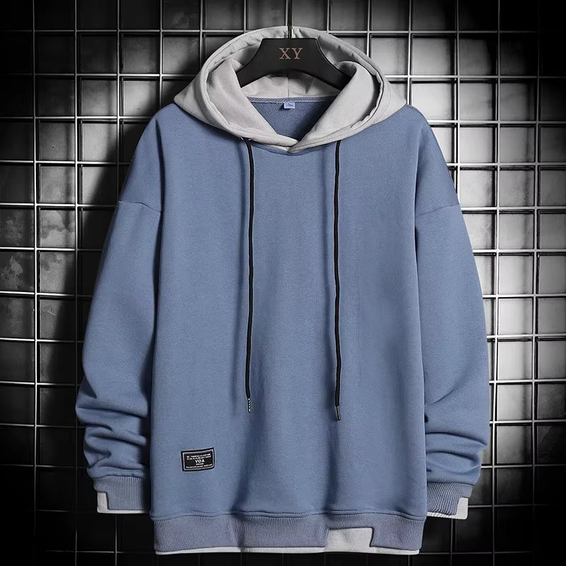 Stylish men's dual-tone hoodie showcasing a unique layered hem design. Ideal comfortable pullover for modern streetwear.