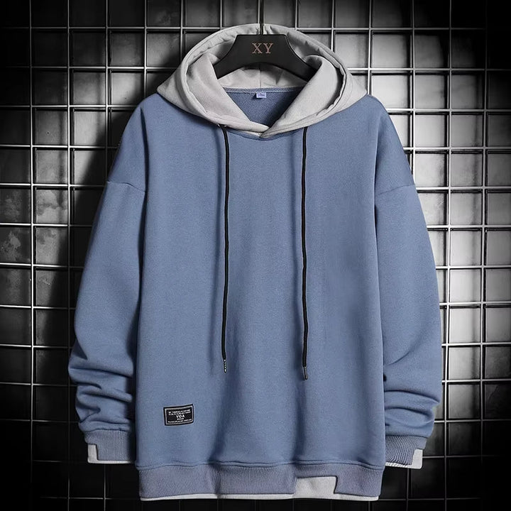 Stylish men's dual-tone hoodie showcasing a unique layered hem design. Ideal comfortable pullover for modern streetwear.