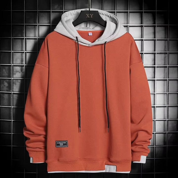 Modern men's dual-tone hoodie, a stylish and comfortable pullover. Features a layered hem, perfect for casual everyday wear.
