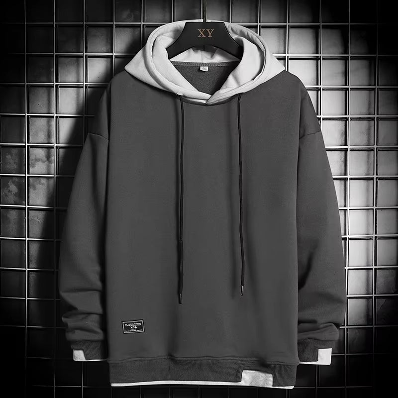 Men's stylish dual-tone layered hem hoodie. A comfortable, casual pullover perfect for modern streetwear and everyday wear.