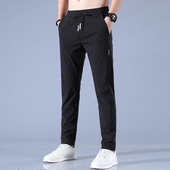 Man wearing comfortable EliteFlex stretch chinos, ideal men's casual pants for modern everyday wear.