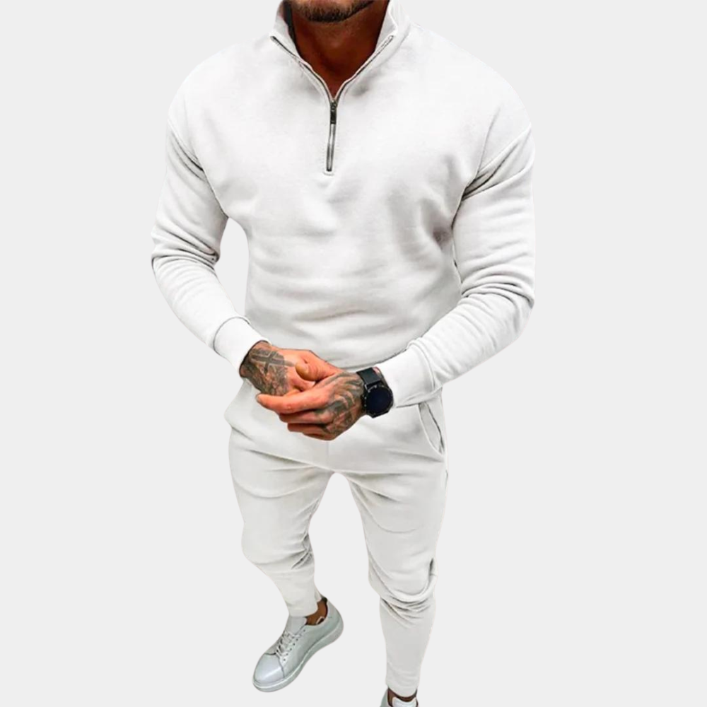 Stylish men's half-zip jogging suit. The comfortable two-piece set offers a sleek look for active or casual wear.