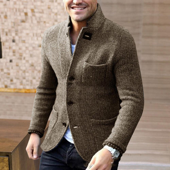 Comfortable men's knitted button-up cardigan, a warm and stylish outerwear option for men.