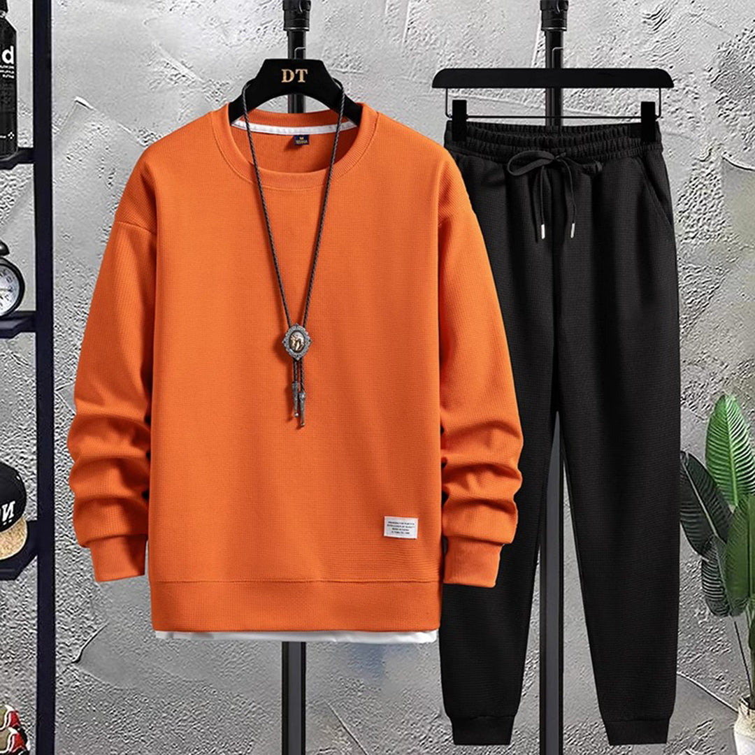 Trendy men's Mason tracksuit. Stylish two-piece jogging set for modern casual outfit and sport fashion activewear.