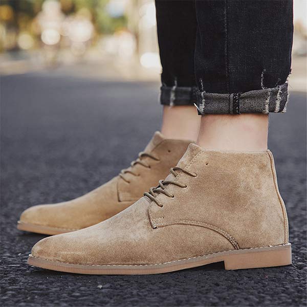 Close-up of men's stylish mid-height lace-up dress shoes, emphasizing sleek design & fit.