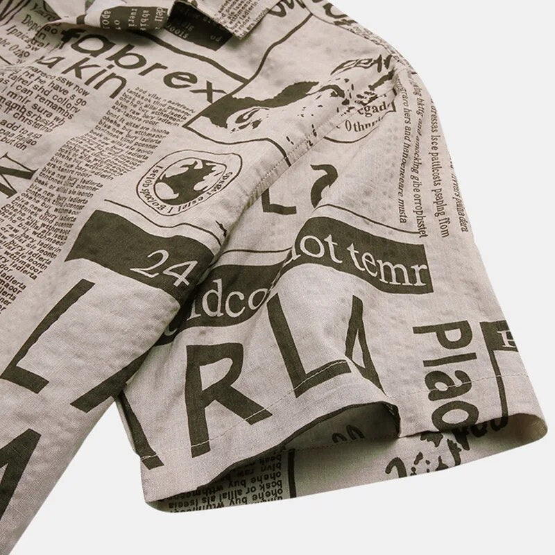Men's model wearing a stylish short-sleeve newspaper print button-up shirt, showcasing casual streetwear.